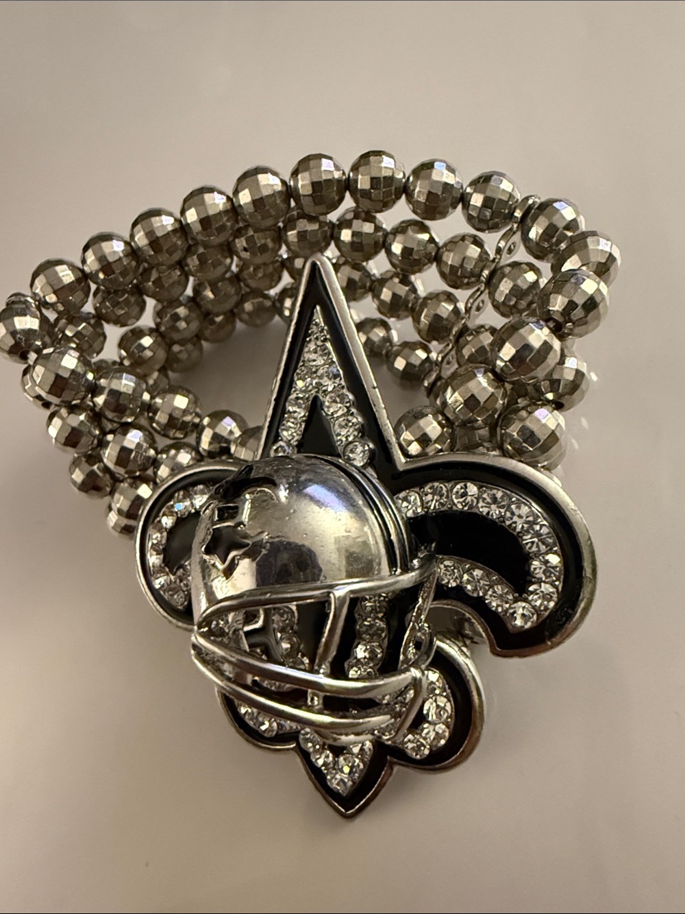 Silver Crystal Fleur-de-Lis Stretch Bracelet with Globe Accent